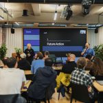 Interactive professional presentation in a modern office setting with diverse audience.